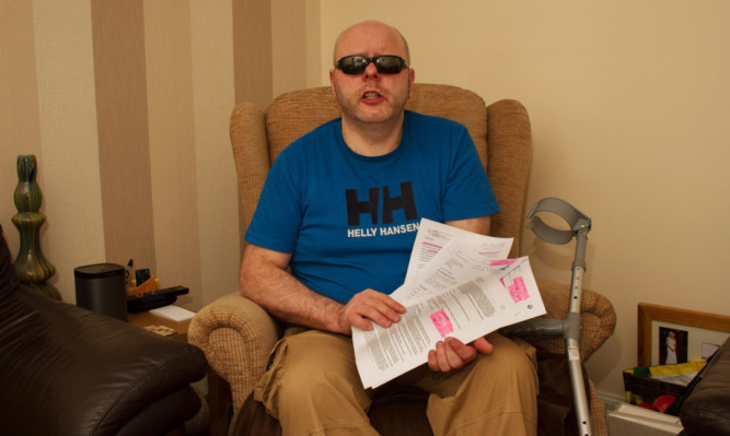 Keith Swankie from Arbroath, who has progressive supranuclear palsy, with some of the correspondence about his problems.