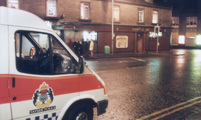 Police outside the Bowbridge Bar in Hilltown in October 1998 after Owen Alexander Kerr murdered Andrew Tosh.