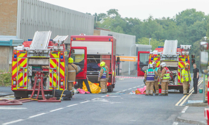 Firefighters get the blaze at the K Hartwall building under control.