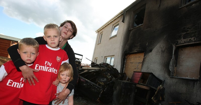 DOUGIE NICOLSON, COURIER, 07/07/10, NEWS.
DATE - Wednesday 7th July 2010.
LOCATION - Flower of Manorgan Close, Inchture.
EVENT - House fire.
INFO - Claire Tulloch outside the remains of her house with kids Brendon - 8, Shaun - 6 and Katie - 3 and a half.
STORY BY - Perth office.