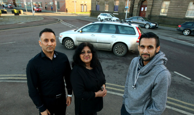Pictured beside the junction at City Quay are Taza Restaurant staff, from left: Vaseem Salimi, manageress Zaib Khan and Shoaib Salimi.