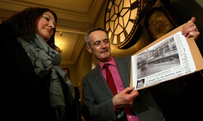 D&A College depute principal Grant Ritchie and Christina Donald with the cutting from the Peoples Journal.