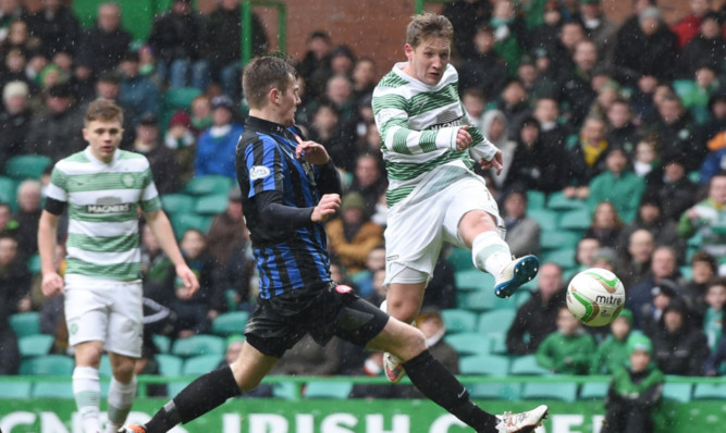 Kris Commons (right) fires the ball into the net to give his side the lead.