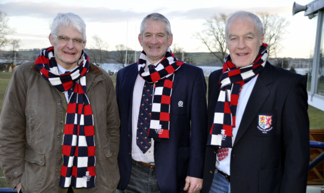 Scotland Grand Slam winners  Finlay Calder, left, David Leslie and Jim Calder, right,   wearing their Grief scarves showing that they appeared more than 25 times in the Scotland shirt  were reunited at Mayfield as Dundee played Stewarts Melville.
