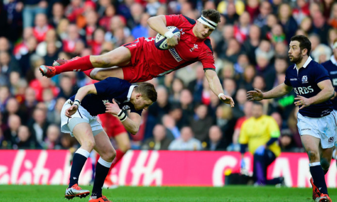 Dan Biggar topples over Finn Russell in the controversial incident during last week's RBS 6 Nations game.