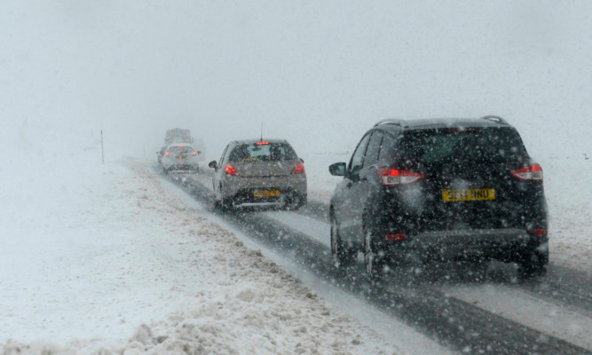 Difficult driving conditions on the A9 between Perth and Inverness at the Drumochter Pass.