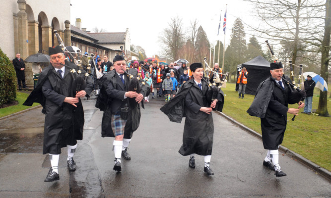 Inverkeithing Pipe Band lead the walk in Dunfermline.