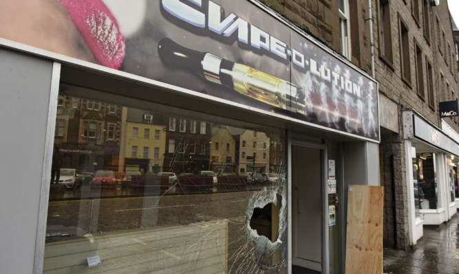 The Evape-O-Lution shop was damaged during the weekend raid.