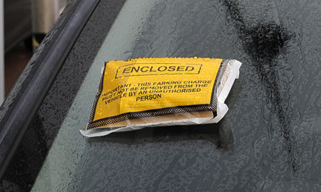 09.12.14 - FOR FILE - parking ticket on car in the Gallagher Retail car park, Dundee - with UKPC sign in the background