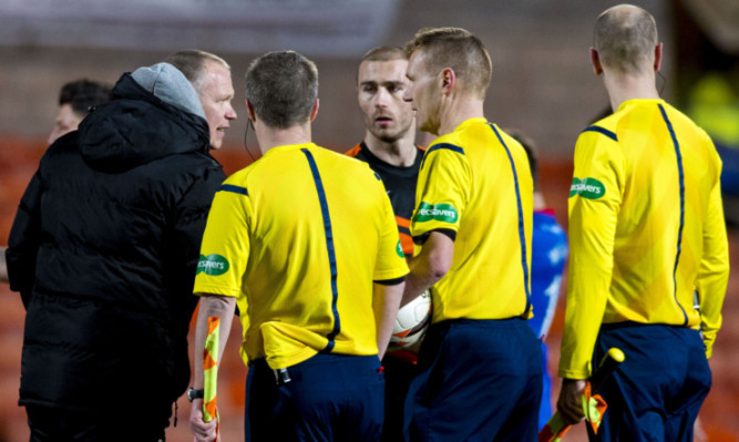 John Hughes approaches referee Calum Murray at full-time.