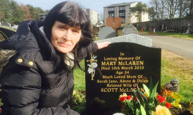 Margaret McIntosh at her daughter's graveside.