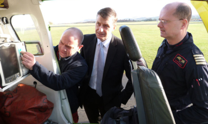 From left: paramedic John Salmond, Simon Howie and Captain Russell Myles.