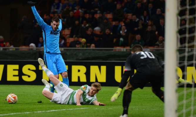 Stuart Armstrong goes down in the box after a challenge from Davide Santon.