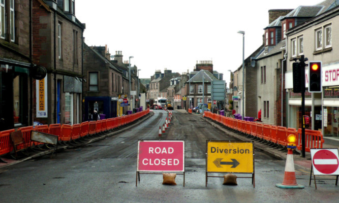 The roadworks at East High Street, Forfar, where a street was repaired and then completely resurfaced only 24 hours after the tar was laid.