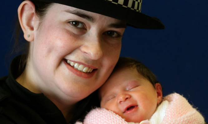 Pc Charlotte Work holds baby Charlotte at Edinburgh Royal Infirmary.