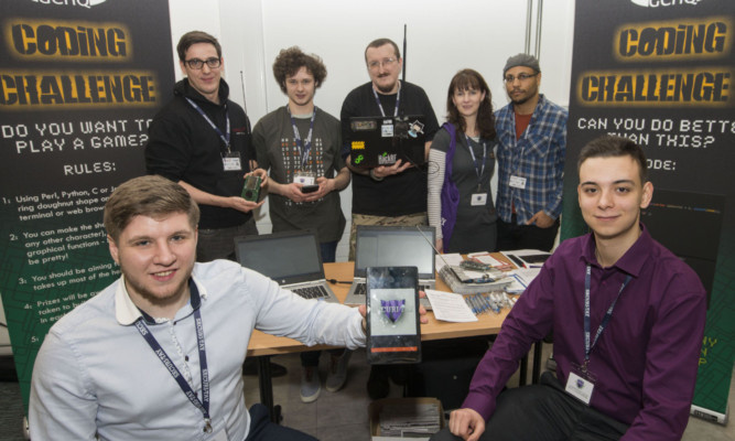 Dominic Cashley, left, president of Abertay Ethical Hacking Society, and Oren Benshabat, right, vice-president, with some of the delegates at the cyber security conference.