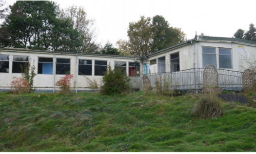 Photographs lodged with the planning application show the poor state of the former school buildings.