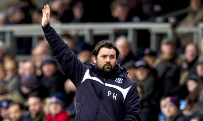 Dundee manager Paul Hartley watches on from the sidelines at Dingwall.