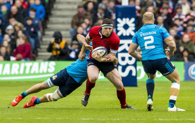 Alasdair Dickinson carries the ball up in Saturday's defeat to Italy.