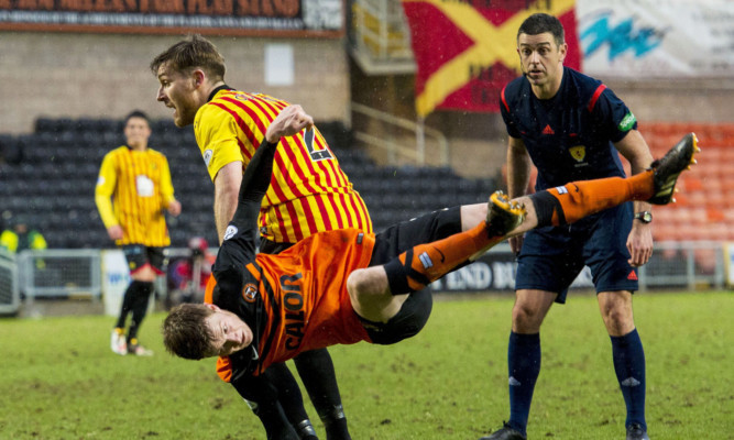Paul Dixon in the thick of it against Partick Thistle on Saturday.