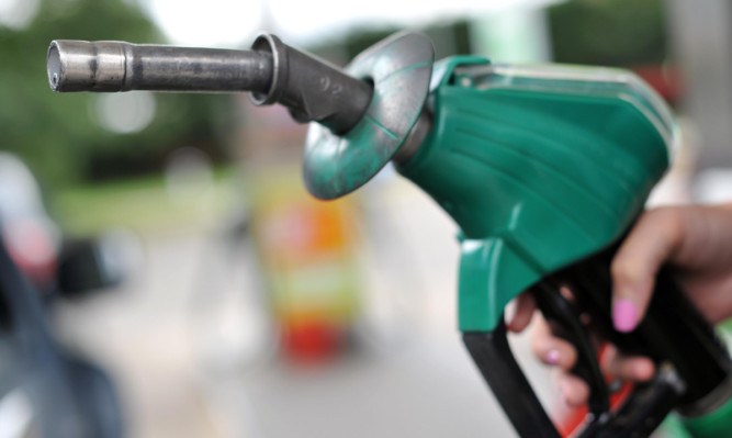 A view of a person using an Asda petrol pump in Chelmsford, Essex. PRESS ASSOCIATION Photo. Picture date: Thursday August 15, 2013. Photo credit should read: Nick Ansell/PA Wire