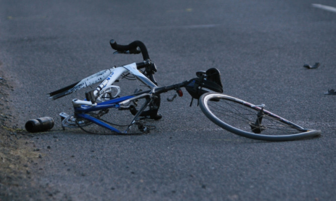 A bike lies mangled in the road after an accident with a car in Angus in 2011.