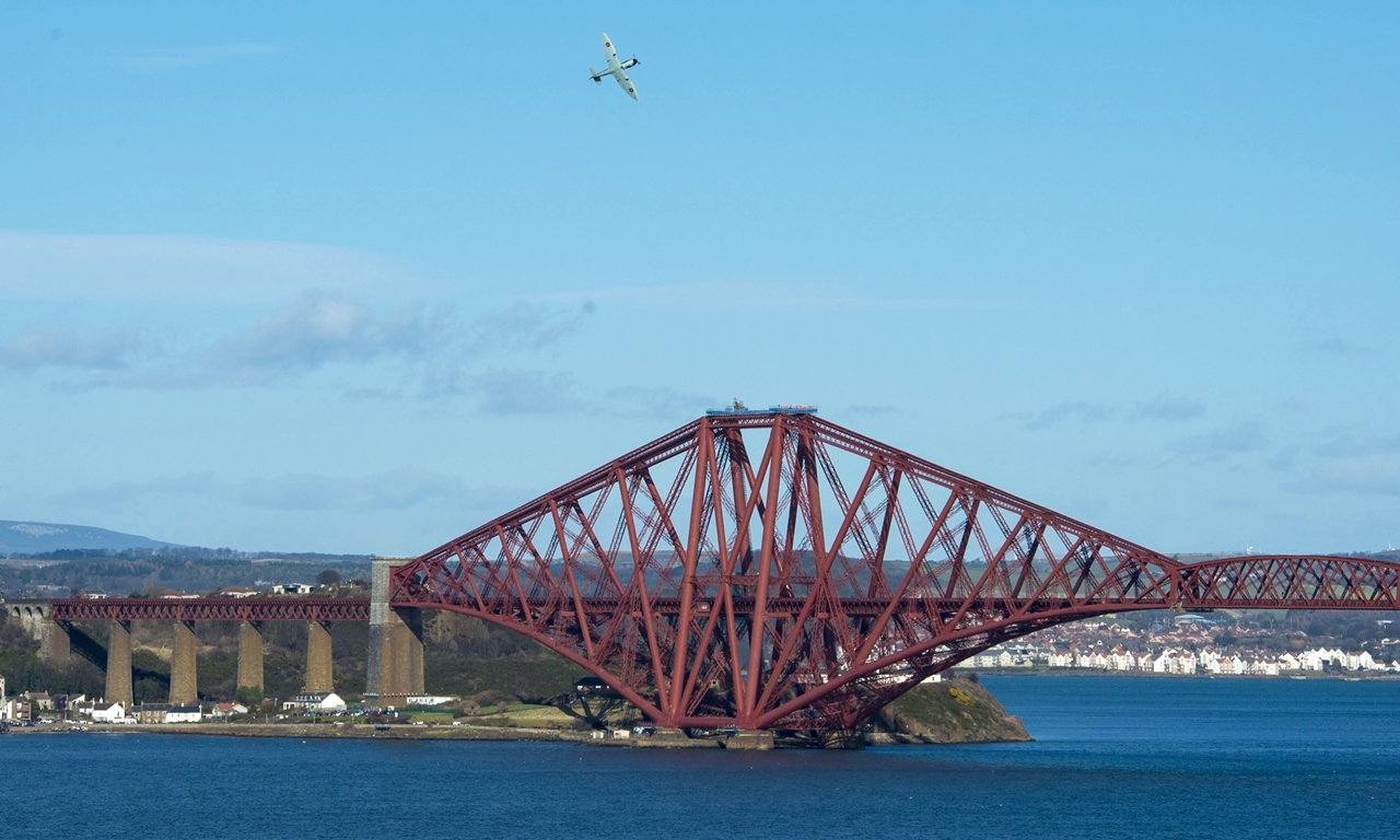 04/03/15 
QUEENSFERRY 
A Spitfire plane flies over the Forth Rail Bridge on it's 125th anniversary
