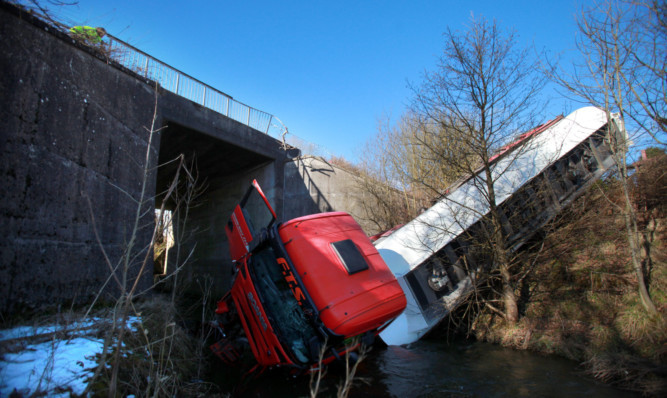 It is believed the vehicle may have lost control on black ice crashing down embankment.