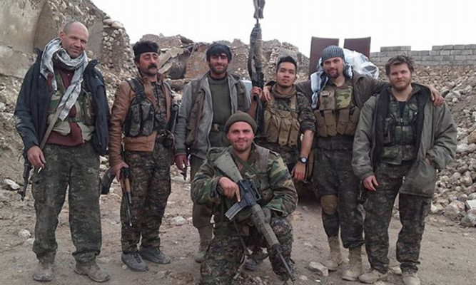 Konstandinos Erik Scurfield (front) pictured with Kurdish fighters in Iraq.