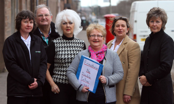 Campaigners against double yellow lines. From left: Lindsay Smith of Davidsons, resident Sandy Thomson, Ray Middleton of La Moda, Ann-Marie Kinnear of The Paper Shop, Kirsty McCready, the Star Inn and Lorna Baird, also of La Moda, who have collected 450 signatures on a petition.