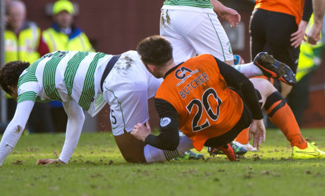 Virgil Van Dijk (left) and Calum Butcher clash.