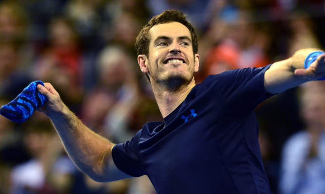 Andy Murray reacts after beating John Isner.
