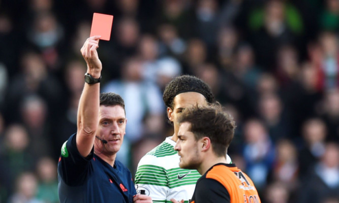 Referee Craig Thomson sends off Dundee Utd's Paul Paton.