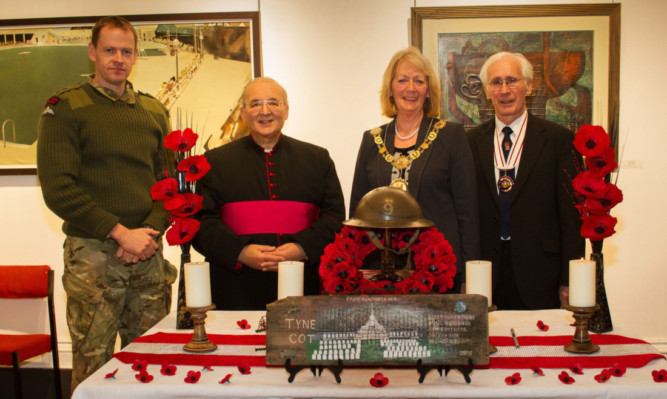 From left: Lt Col Dan Cheesman of 45 Commando, Monsignor Aldo Angelosanto, Provost of Angus Helen Oswald and Andrew Welsh at the lighting of a Commonwealth Day candle.