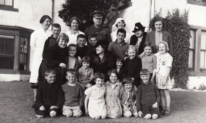 The eighth Duke of Atholl with children at Blair Castle who were evacuated to the area during the Second World War.