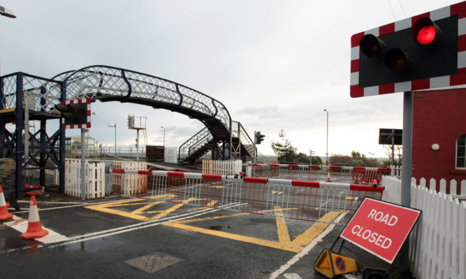 the railway line at the station level crossing, which people feel cuts the town off from its seafront.