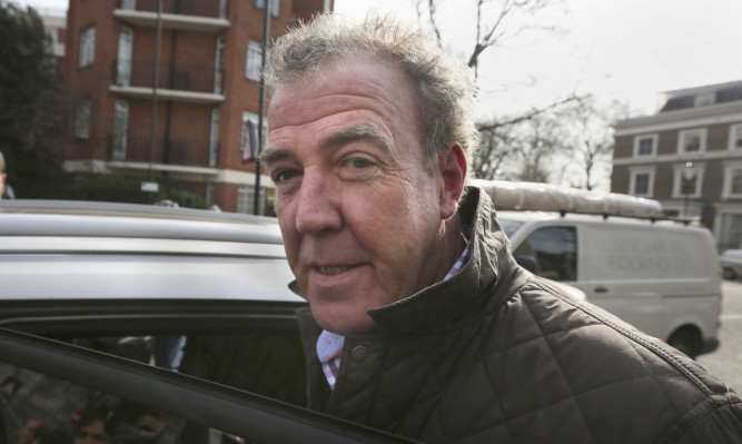 Jeremy Clarkson leaves his home in London, as he laughed off his latest controversy telling reporters he was "just off to the job centre" after the BBC suspended him following a row with a Top Gear producer.