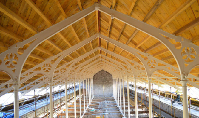 The interior of the High Mill, showing its gothic cast iron roof trusses after its restoration.