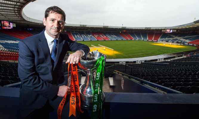 Dundee United manager Jackie McNamara with the League Cup.