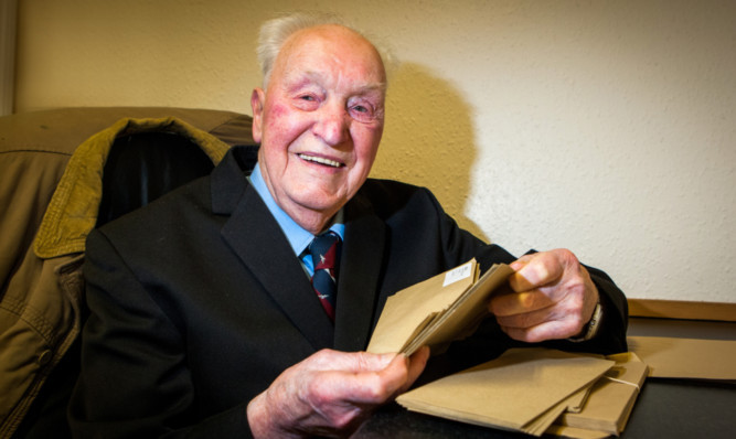 George Cameron, 92, loves his job as a messenger for Lawson, Coull & Duncan solicitors. He feels no need to retire just yet.
