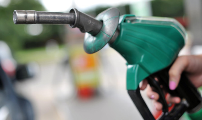 A view of a person using an Asda petrol pump in Chelmsford, Essex. PRESS ASSOCIATION Photo. Picture date: Thursday August 15, 2013. Photo credit should read: Nick Ansell/PA Wire