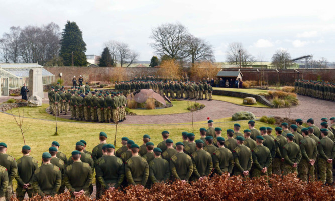 Royal Marines at a service in the Woodlands Garden at RM Condor.