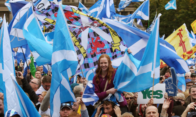 Scottish Independence supporters at the Hope over Fear Rally in George Square in Glasgow, which is aimed at keeping the momentum of YES supporters going. PRESS ASSOCIATION Photo. Picture date: Sunday October 12, 2014. See PA story SCOTLAND Rally. Photo credit should read: Andrew Milligan/PA Wire