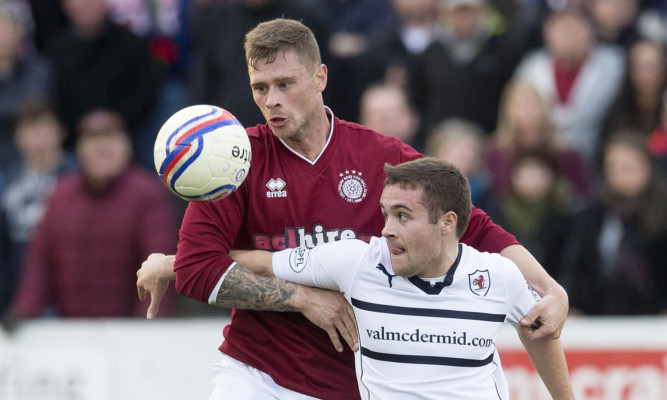 Lewis Vaughan has his eyes on the ball in action for Raith Rovers in season 2014-15.