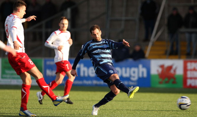 Forfars Gavin Swankie goes for goal.