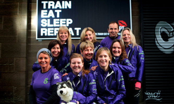 The team with trainer Shelley Booth, front left.