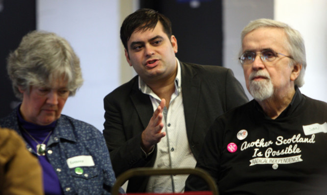 Jonathan Shafi, centre, national spokesman for the Radical Independance Campaign speaking to members of the audience.