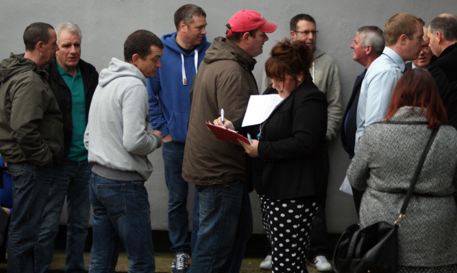 Workers arriving at the jobs fair.