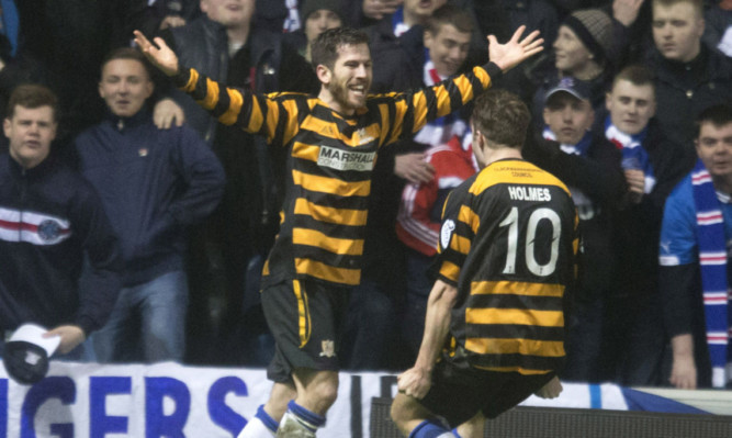 Liam Buchanan celebrates his late leveller.