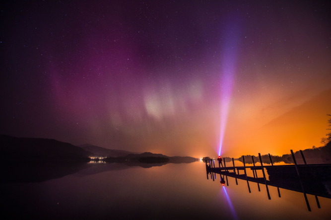 Skygazers have been treated to another spectacular display of the Northern Lights over the skies of Britain. Increased solar activity meant that people in areas without cloud cover had the chance of catching the colourful phenomenon in the early hours. Met Office forecaster Craig Snell said: It was the biggest solar flare that has come to earth in the last 19 to 20 years. There were reds and greens which lit up the sky. This photo shows a view from Keswick in the Lake District.